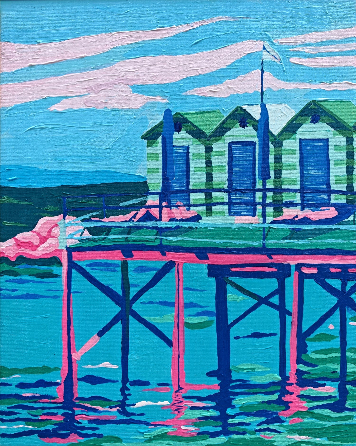 A colorful painted scene of a seaside pier with three green-and-white huts, blue umbrellas, pink railings, and turquoise water under a blue and pink sky.